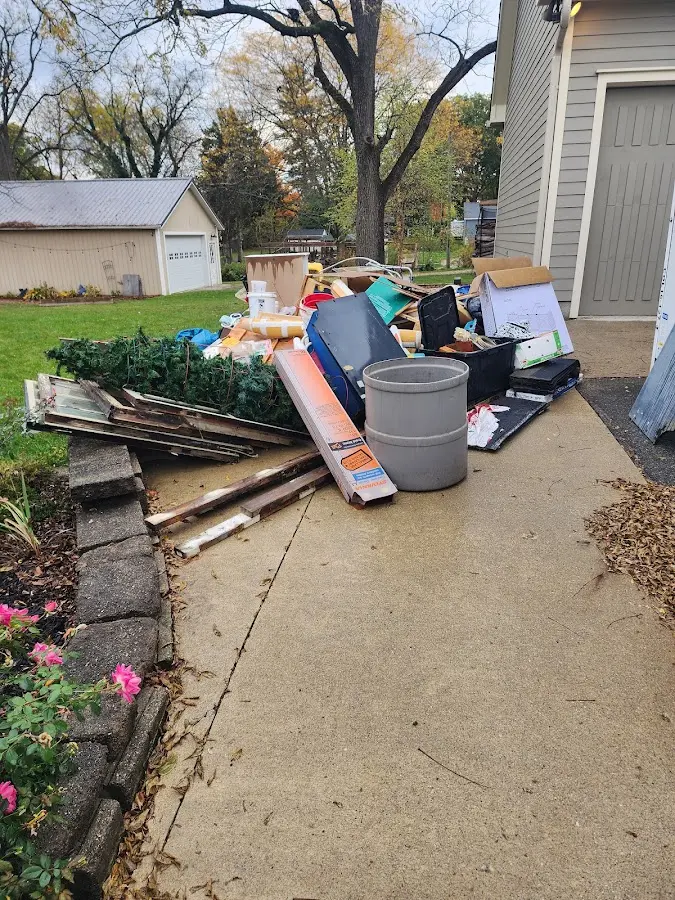 Dumpster being loaded with debris for Residential Dumpster Rental in Middletown